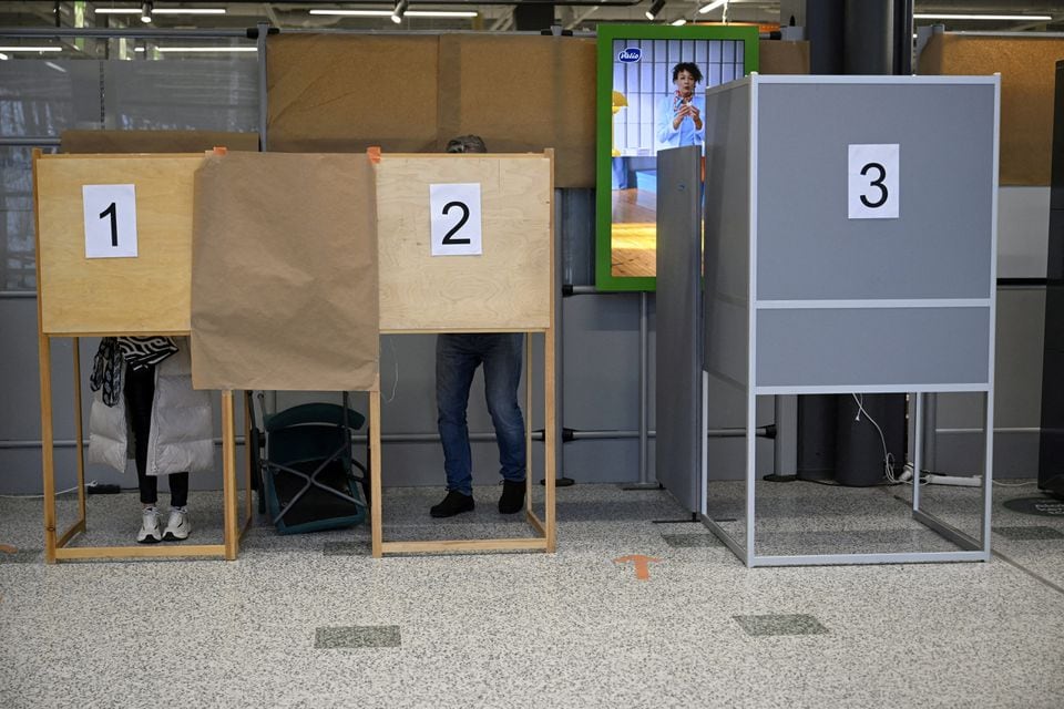 People vote in advance during the second round of the Finnish presidential election at a store in Espoo, Finland, on the last day of advance voting, February 6, 2024. Lehtikuva/Antti Aimo-Koivistovia REUTERS