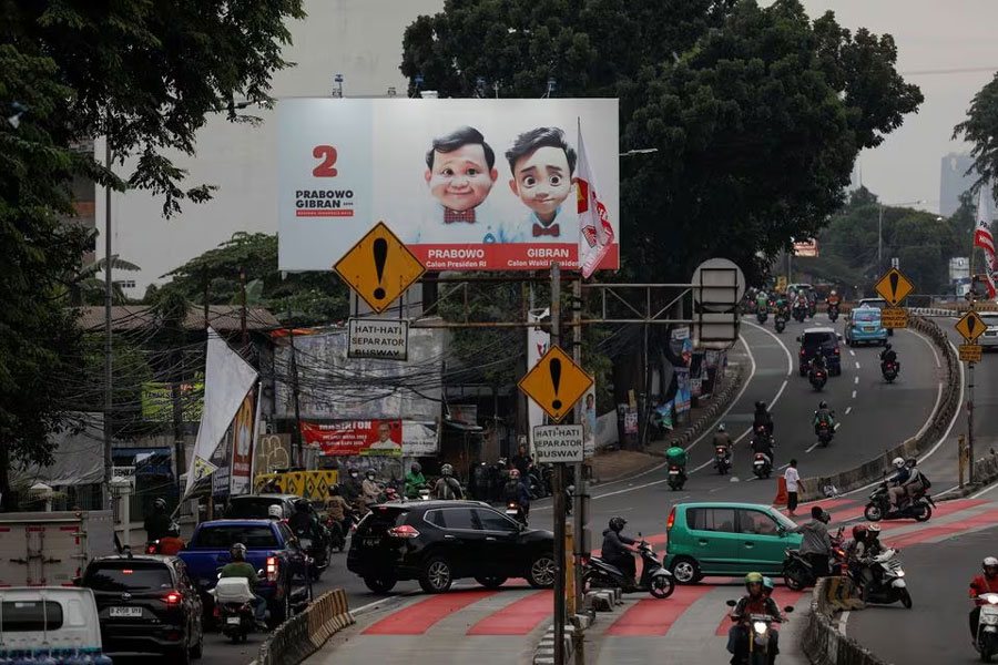 A billboard promoting Indonesia's Defence Minister and Presidential candidate Prabowo Subianto and his running mate Gibran Rakabuming Raka, who is the eldest son of Indonesian President Joko Widodo and current Surakarta's Mayor, is pictured during rush hours in Jakarta, Indonesia, January 12, 2024.