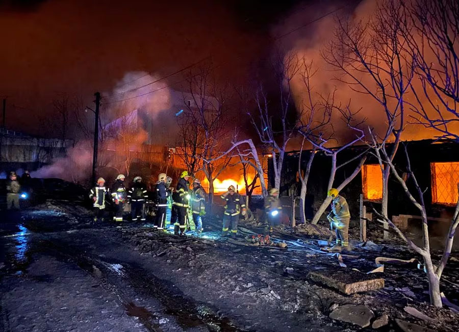 Firefighters work at a site of a Russian drone strike, amid Russia's attack on Ukraine, in Kharkiv, Ukraine February 10, 2024.