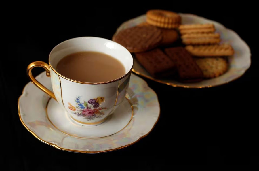 A cup of tea and plate of biscuits are photographed in London June 6, 2012.