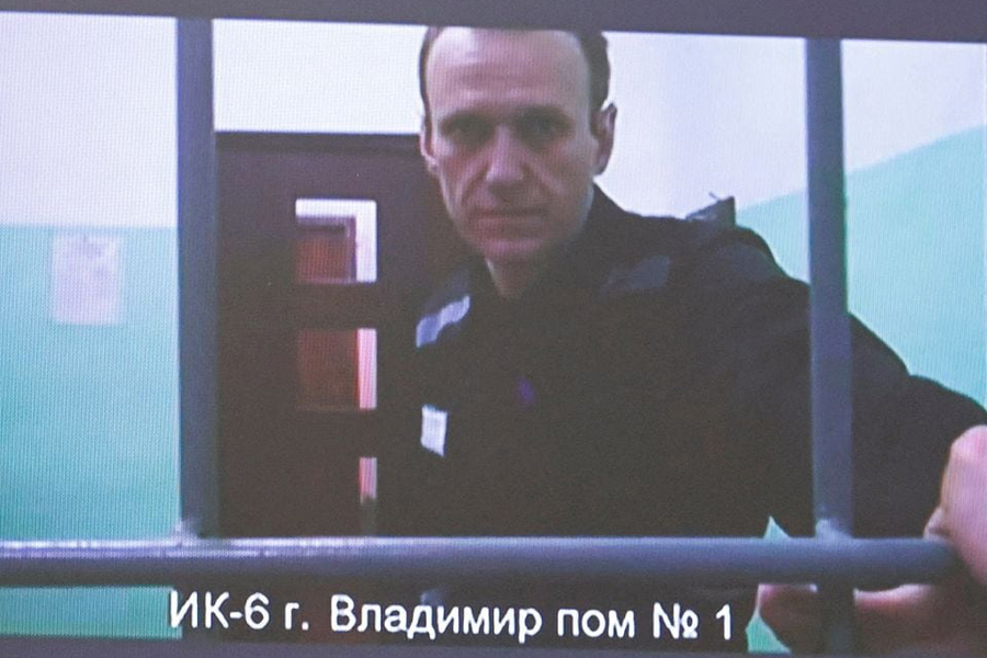 Russian opposition politician Alexei Navalny appears on a screen via video link from the IK-6 penal colony in the Vladimir region, during a court hearing to consider an appeal against his sentence in the criminal case on numerous charges, including the creation of an extremist organization, in Moscow, Russia September 26, 2023.