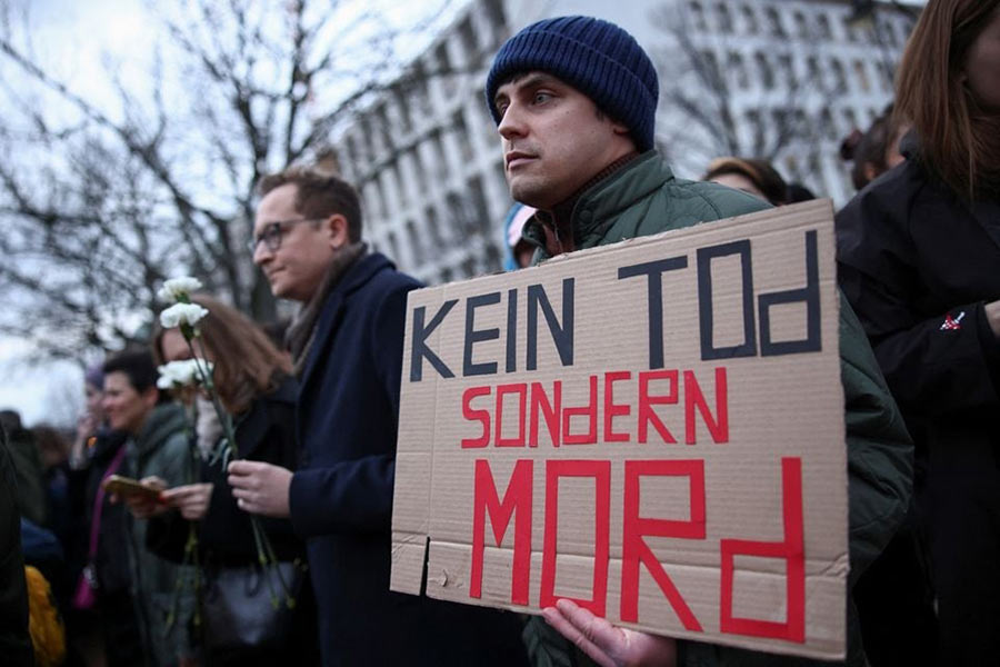 A man holding a placard that reads ‘Not death, but murder’ at a vigil held in front of the Russian embassy in Berlin on Friday –Reuters photo