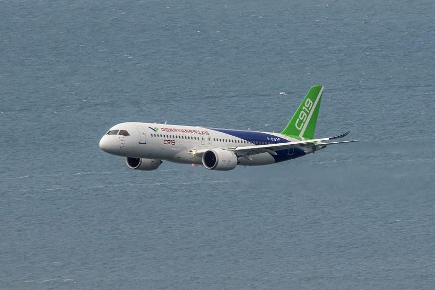 The C919 made its first trip outside Chinese territory, staging a fly-by at the Singapore Airshow on Feb 18. PHOTO: REUTERS