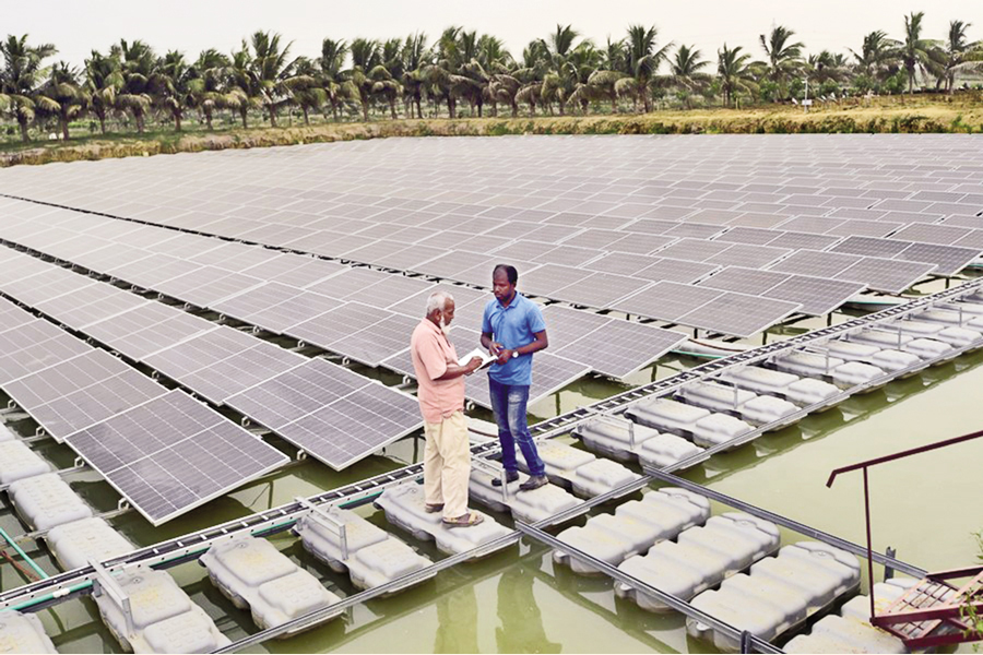 Technicians inspect floating solar panels installed on reservoirs in Chapainawabganj—Xinhua Photo