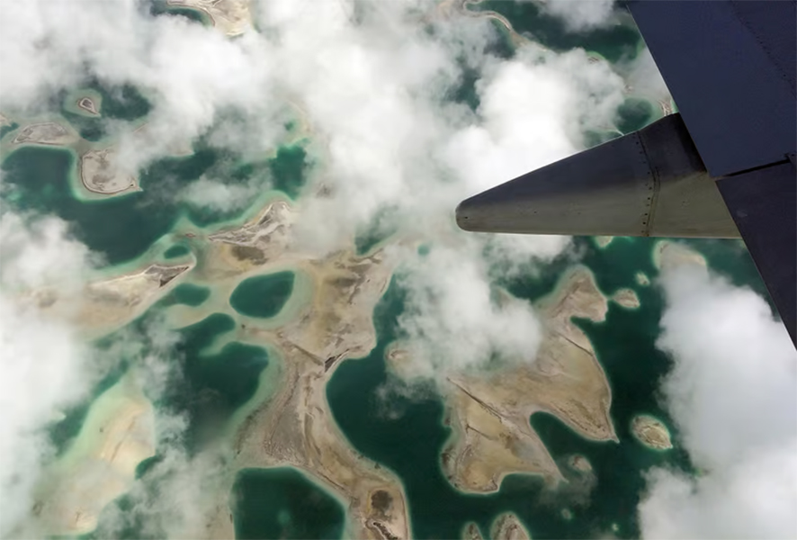 Lagoons can be seen from a plane as it flies above Kiritimati Island, part of the Pacific Island nation of Kiribati, April 5, 2016. REUTERS