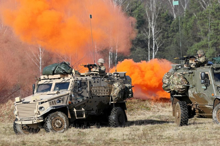 Soldiers sit in military vehicles during the NATO's Steadfast Defender Brilliant Jump 2024 military exercise in Drawsko Pomorskie, Poland, February 26, 2024.