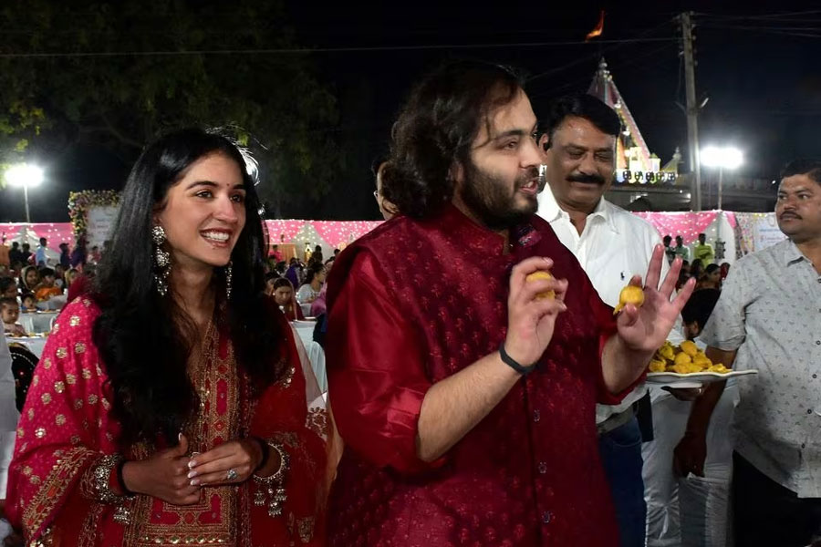 Anant Ambani, son of Mukesh Ambani, Chairman of Reliance Industries, and Radhika Merchant, daughter of industrialist Viren Merchant, serve traditional Gujarati food to villagers ahead of their pre-wedding celebrations on the outskirts of Jamnagar, Gujarat, India, February 28, 2024.