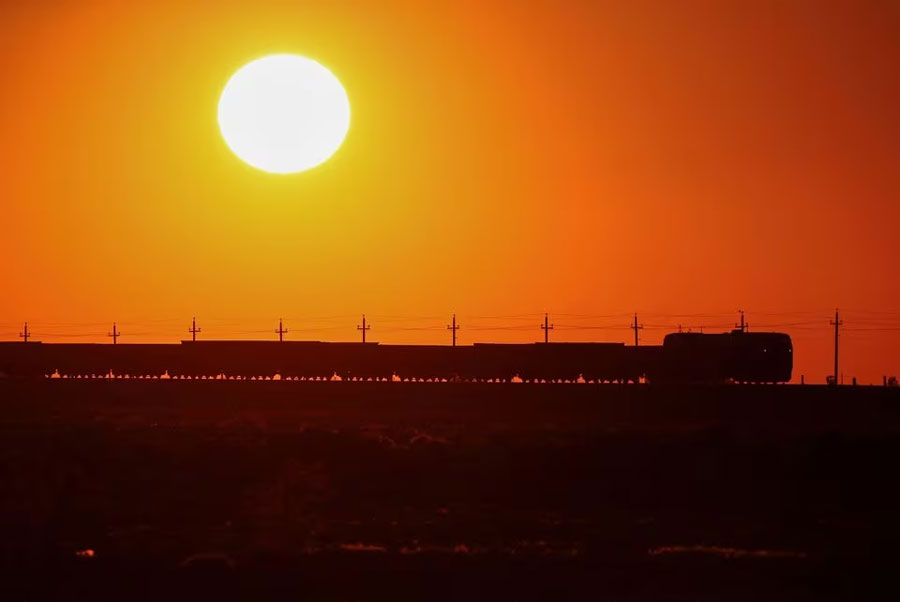 A freight train moves during sunset in the Almaty region, Kazakhstan on May 3, 2023
