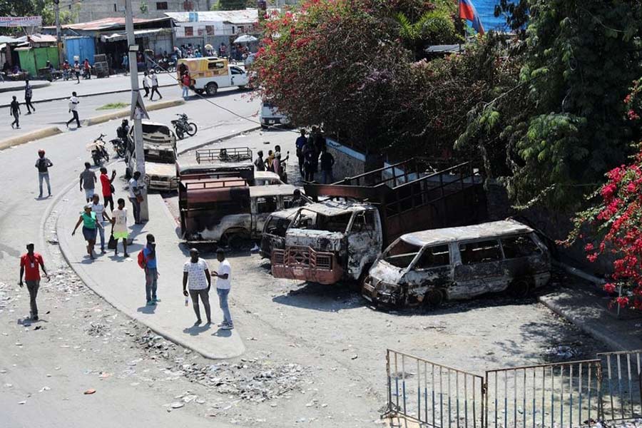 Vehicles which were set on fire by armed gangs on Monday night are seen outside the Carrefour de l'Aeroport sub-police station of the Haitian National Police (PNH), in Port-au-Prince, Haiti, on Tuesday –Reuters photo