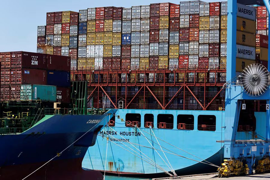 Cargo containers are stacked on ships at Haifa Port, which is to be sold to India's Adani Ports and local partner Gadot in Haifa, Israel July 24, 2022.