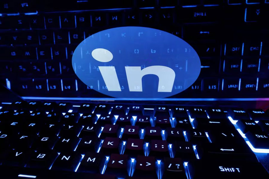 A keyboard is placed in front of a displayed LinkedIn logo in this illustration taken February 21, 2023.
