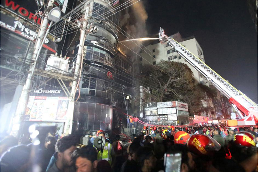 Fire fighters struggling to douse the devastating fire at the multi-storey building in Dhaka's Bailey Road on Thursday night—Xinhua Photo