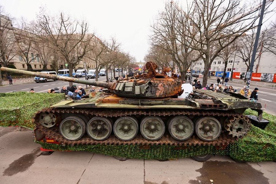 The remains of a destroyed Russian T-72 tank, secured from the Ukrainian village of Dmytrivka, outside Kyiv are on display near the the Brandenburg Gate during an event to mark the one-year anniversary of the Russian invasion of Ukraine, in Berlin, Germany, February 24, 2023.