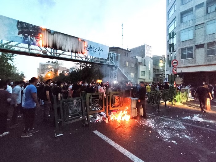 People light a fire during a protest over the death of Mahsa Amini, a woman who died after being arrested by the Islamic republic's "morality police", in Tehran, Iran September 21, 2022.
