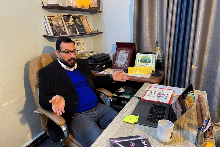 Iraqi journalist Muntadhar al-Zaidi, who gained fame for hurling his shoes at President George W. Bush during a joint statement with Iraqi Prime Minister Nouri al-Maliki in December 14, 2008, sits at his home in Baghdad, Iraq on February 8, 2023 — Reuters/Files