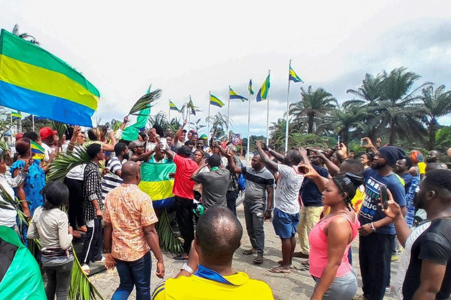 People celebrate in support of the putschists in the street of Libreville, Gabon, August 30, 2023.