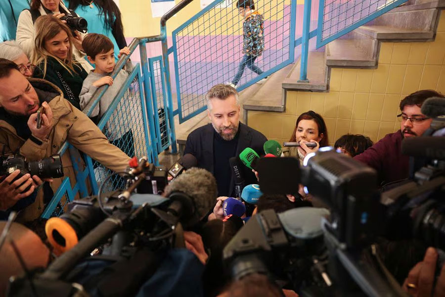 Portugal's Socialist Party (PS) Secretary General Pedro Nuno Santos speaks to the members of the media after voting at a polling station during the general election in Lisbon, Portugal, March 10, 2024.
