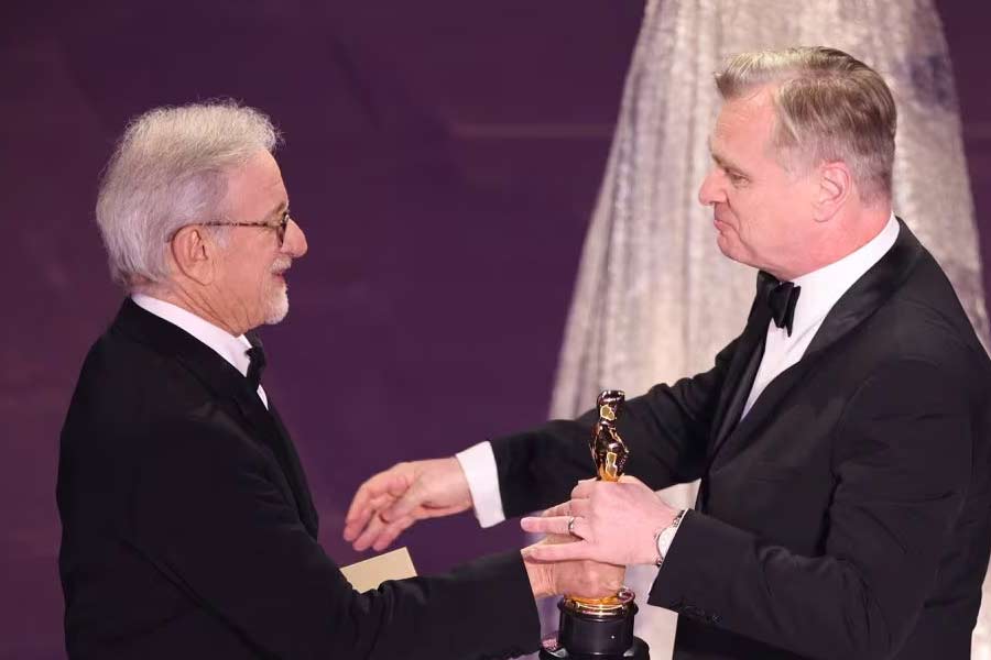 Christopher Nolan receiving the Oscar for Best Director for "Oppenheimer" from presenter Steven Spielberg during the Oscars show at the 96th Academy Awards in Los Angeles on Sunday –Reuters photo