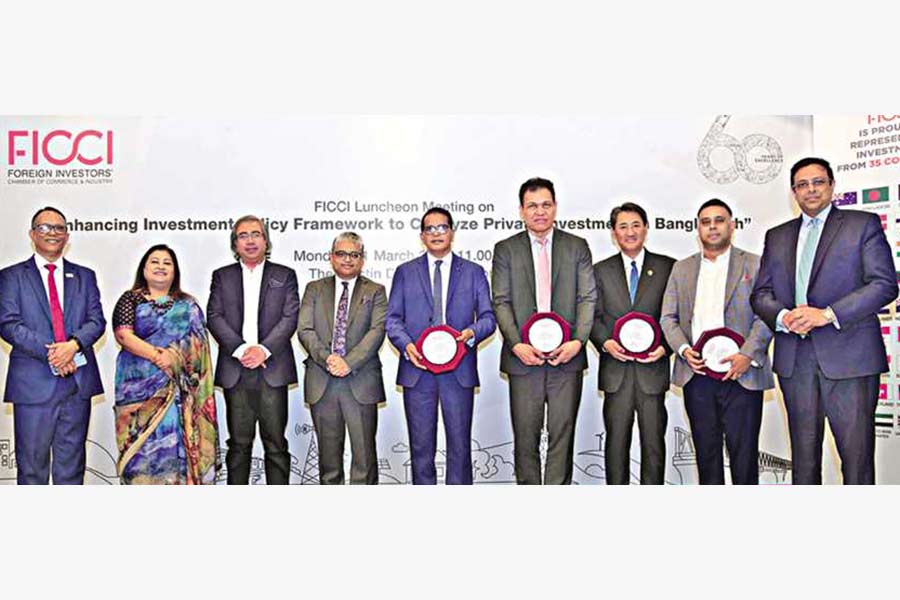 Executive Chairman of Bangladesh Investment Development Authority (BIDA) Lokman Hossain Miah, Country Director for Bangladesh at Asian Development Bank Edimon Ginting, JBCCI President Myung-Ho Lee and Chairman of Policy Exchange Bangladesh Dr. M. Masrur Reaz along with FICCI office-bearers at the luncheon meeting organised by the Foreign Investors Chamber of Commerce and Industry (FICCI) at a city hotel on Monday.