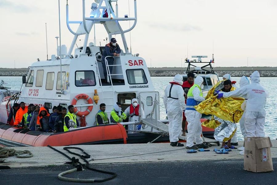 Migrants who survived a deadly shipwreck in the central Mediterranean, disembarking in the Sicilian harbour of Pozzallo in Italy on Monday –Reuters photo
