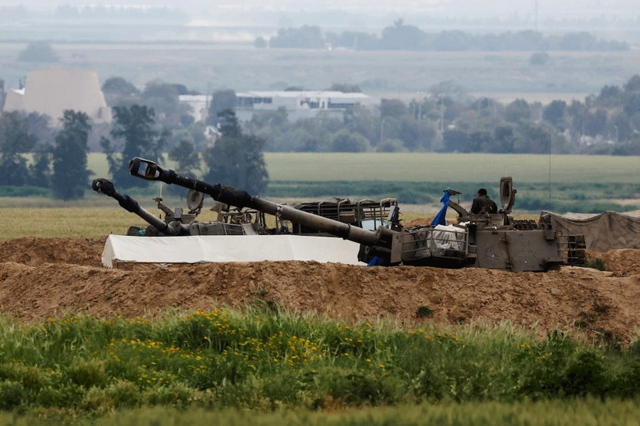 An Israeli soldier stands in an artillery unit at a military post near the Israel-Gaza border, amid the ongoing conflict between Israel and the Palestinian Islamist group Hamas, in Israel March 14, 2024.