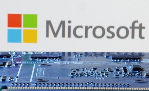 Microsoft logo is seen near computer motherboard in this illustration taken January 8, 2024. REUTERS/Dado Ruvic/Illustration/File Photo