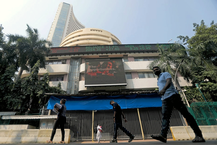 People walk past the Bombay Stock Exchange (BSE) building in Mumbai, India, November 4, 2020.