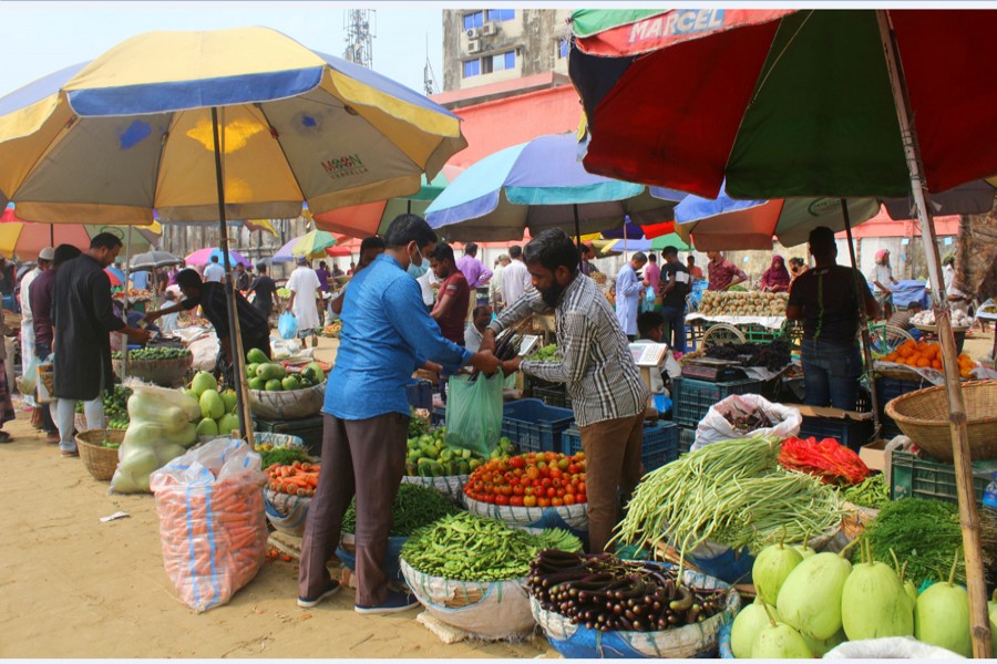Customers buying commodities from shops at a newly-launched market in Laldighirpar area of Sylhet city
