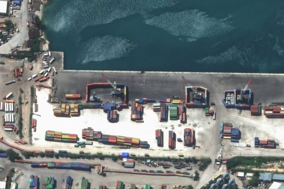 A satellite image shows shipping containers used to block access to heavy cranes, in Port-au-Prince, Haiti, March 14, 2024, in this handout image. Maxar Technologies/Handout via REUTERS/File Photo