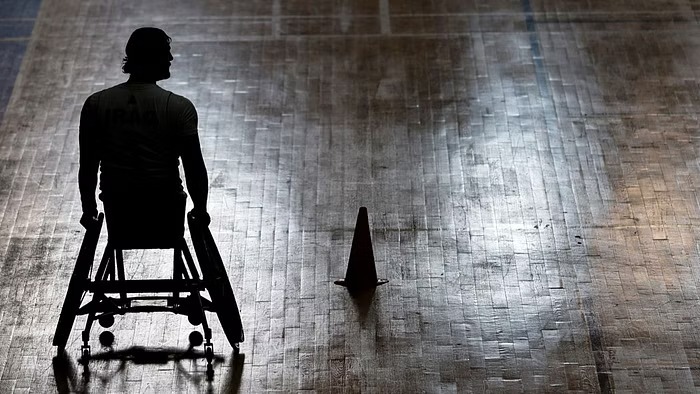 Iraqi former footballer Ahmed Nasser, who lost his leg during a bomb attack in Baghdad in 2007, plays basketball with Iraq's Paralympic team in a training session in Baghdad, Iraq Feb 1, 2023.