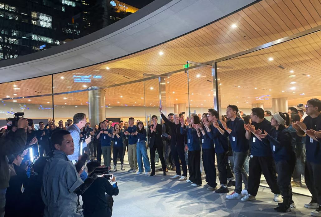 Apple CEO Tim Cook arrives at the new Apple store for its opening, in Shanghai, China March 21, 2024. REUTERS/Brenda Goh
