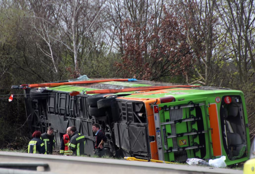 Emergency staff talk at the scene after several people were killed and more injured in a coach crash on the A9 motorway off Schkeuditz, near the eastern German city of Leipzig, Germany, March 27, 2024. REUTERS/Marvin Matzulla/Mitteldeutsche Zeitung