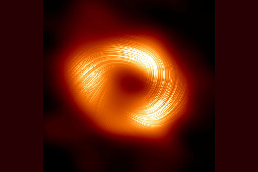 The Event Horizon Telescope (EHT) collaboration, who produced the first ever image of our Milky Way black hole released in 2022, has captured a new view of the massive object at the centre of our Galaxy: how it looks in polarised light. This is the first time astronomers have been able to measure polarisation, a signature of magnetic fields, this close to the edge of Sagittarius A*. This image shows the polarised view of the Milky Way black hole. The lines overlaid on this image mark the orientation of polarisation, which is related to the magnetic field around the shadow of the black hole.
