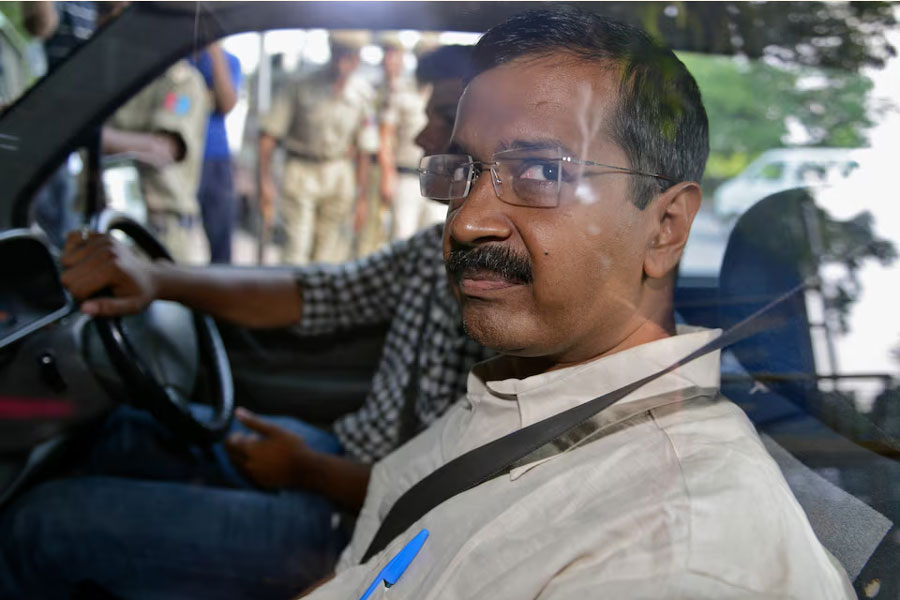 Arvind Kejriwal, the head of the Aam Aadmi (Common Man) Party (AAP), which briefly controlled the state government in Delhi, looks out from inside his car as he arrives at a court in New Delhi May 21, 2014.