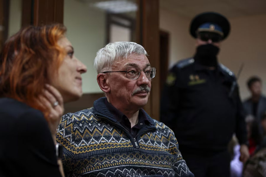 Russian veteran human rights campaigner Oleg Orlov sits next to his lawyer Yekaterina Tertukhina during a court hearing in Moscow, Russia, February 27, 2024.