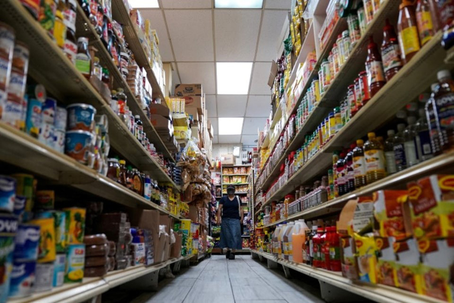 A woman shops for groceries at El Progreso Market in the Mount Pleasant neighbourhood of Washington, DC, US, August 19, 2022.