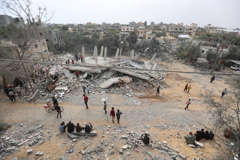 Palestinians inspect the site of an Israeli strike on a house, amid the ongoing conflict between Israel and Hamas, in Khan Younis in the southern Gaza Strip on March 29, 2024 — Reuters photo