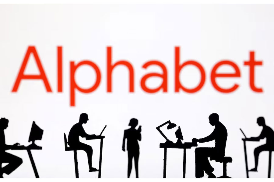 Figurines with computers and smartphones are seen in front of Alphabet logo in this illustration taken, February 19, 2024.