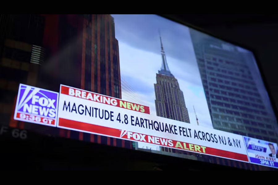 A screen at the New York Stock Exchange (NYSE) shows a news alert of a magnitude 4.8 earthquake in New York City, US, Apr 5, 2024.