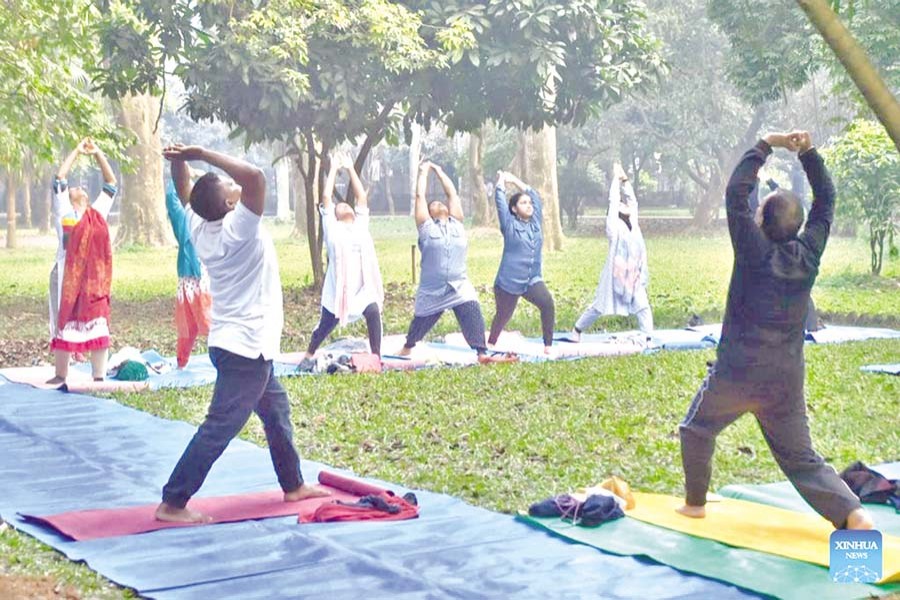 People exercise at Ramna Park in Dhaka —Xinhua Photo