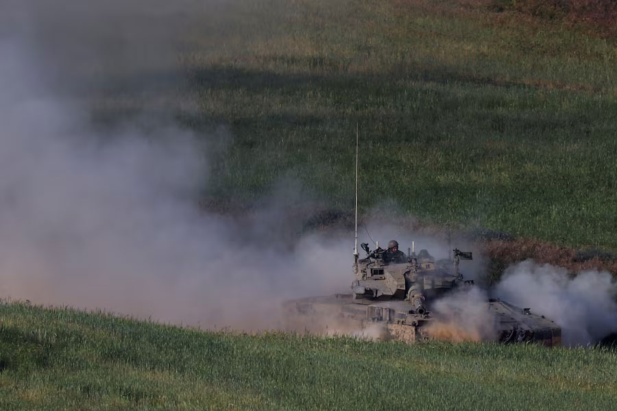 An Israeli tank manoeuvres near the Israel-Gaza border, amid the ongoing conflict between Israel and the Palestinian Islamist group Hamas, in southern Israel, April 2, 2024.