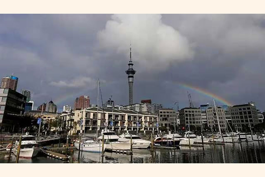 A rainbow appears on the Auckland skyline featuring Sky Tower in New Zealand, July 8, 2017.