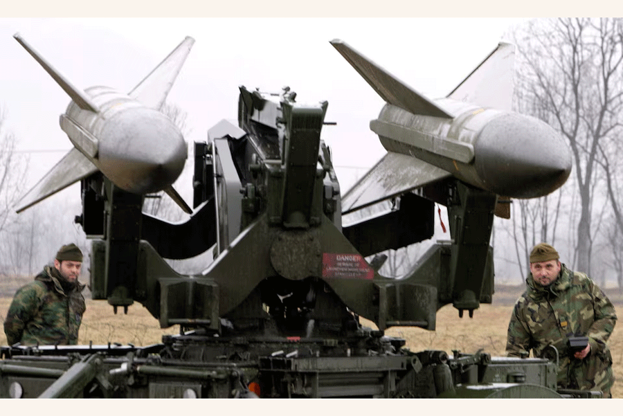 Soldiers from an Italian army anti-aircraft artillery regiment check a HAWK missile launcher guarding the Torino 2006 Winter Olympic Games near Turin, Italy February 24, 2006.