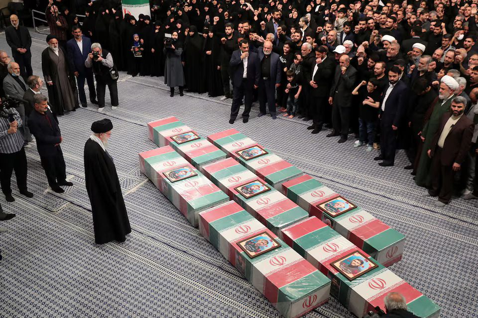 Iran's Supreme Leader, Ayatollah Ali Khamenei looks at the coffins of members of the Islamic Revolutionary Guard Corps who were killed in the Israeli airstrike on the Iranian embassy complex in the Syrian capital Damascus, during a funeral ceremony in Tehran, Iran on April 4, 2024 — Office of the Iranian Supreme Leader/WANA (West Asia News Agency)/Handout via REUTERS/File