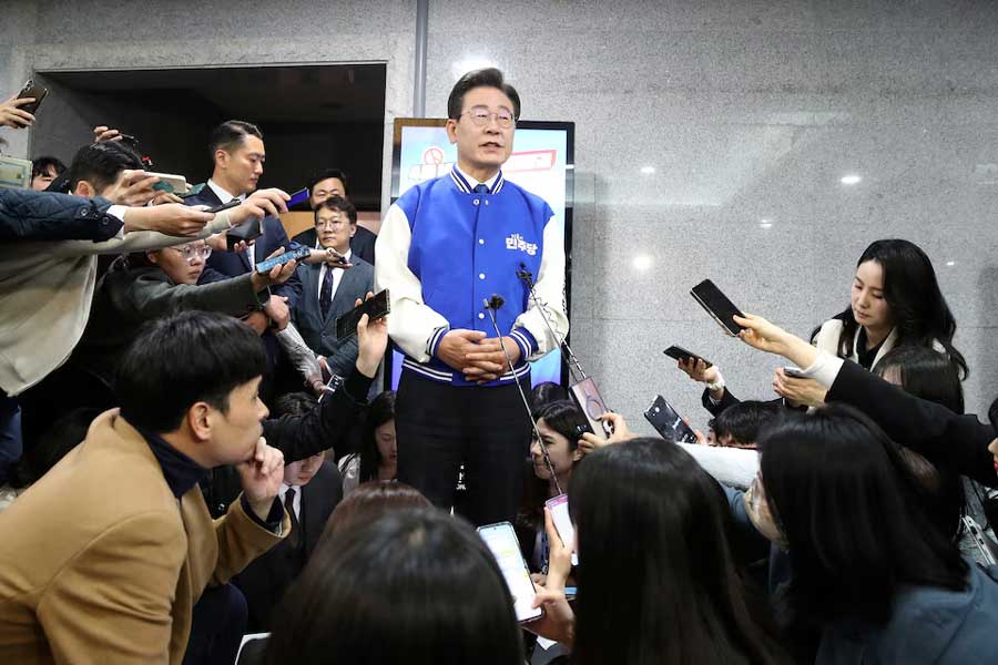 South Korea's main opposition Democratic Party (DP) leader Lee Jae-myung, speaks to reporters after watching TVs broadcasting the results of exit polls for the parliamentary election at the National Assembly on April 10, 2024 in Seoul, South Korea.