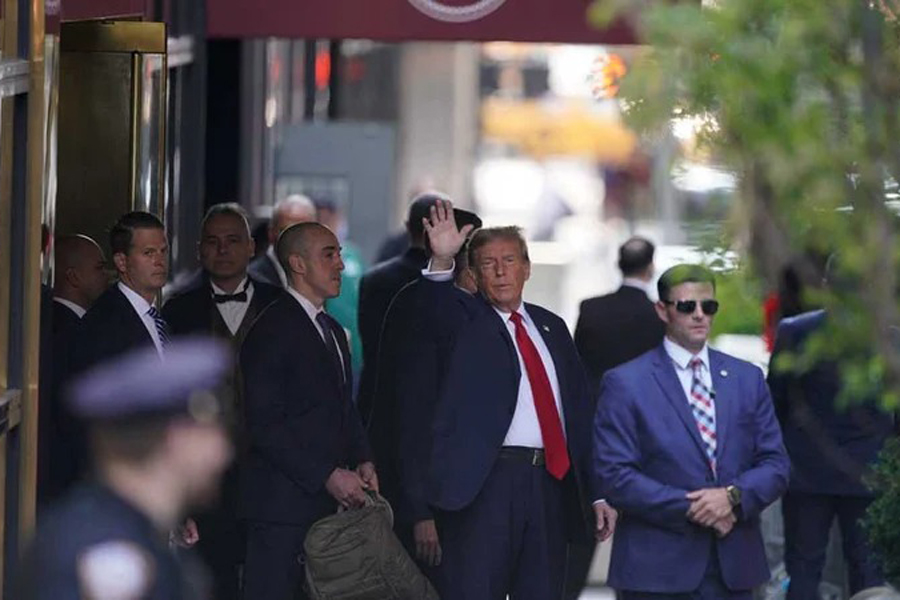 Former US President Donald Trump gestures on the day of hush money criminal trial, outside Trump Tower, in New York, US, April 15, 2024.