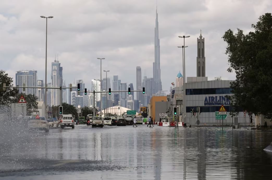 A general view of flood water caused by heavy rains, with the Burj Khalifa tower visible in the background, in Dubai, United Arab Emirates, April 17, 2024. REUTERS/Amr Alfiky