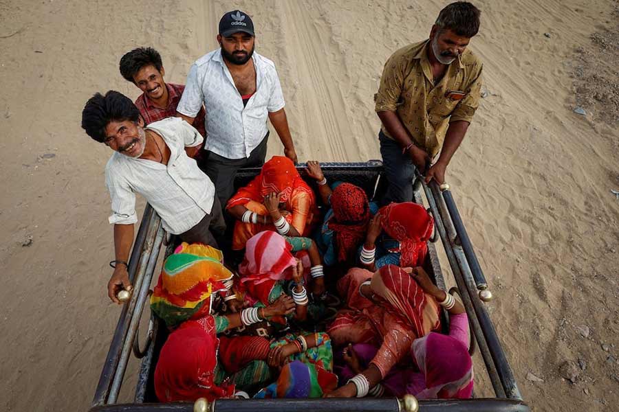 Women sitting inside a vehicle after casting their vote at a polling station during the second phase of the general elections in Rajasthan of India on Friday –Reuters photo