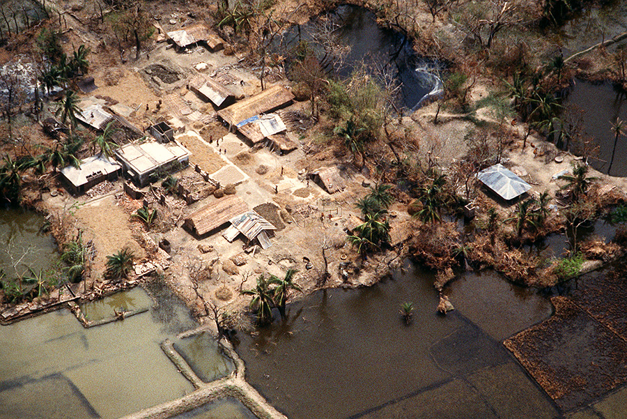 An aerial view of a damaged village surrounded by flooded fields, nearly three weeks after the cyclone hit the country in 1991 — Wikipedia photo