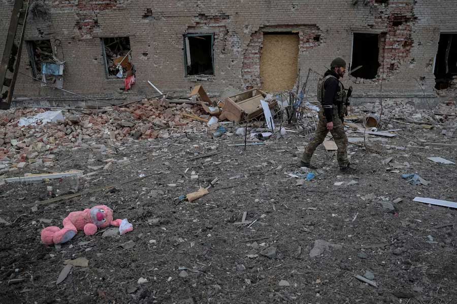 A Ukrainian serviceman walks near destroyed building, amid Russia's attack on Ukraine, in the frontline town of Chasiv Yar in Donetsk region, Ukraine March 5, 2024.